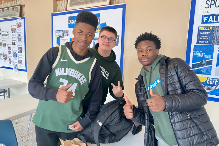 Students giving thumbs up