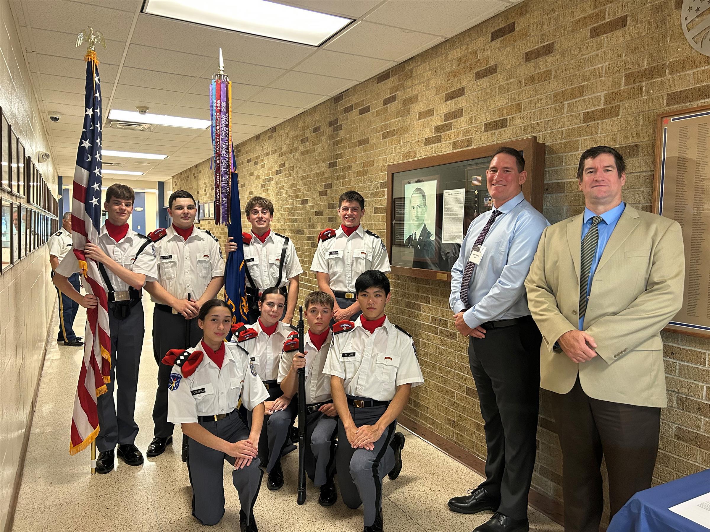 Steve & John Unwin with the O’Donovan Rifle Team posing in the hallway