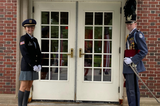 honor guard assisting with opening the doors