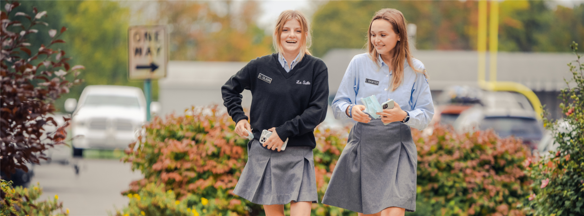female students walking into school